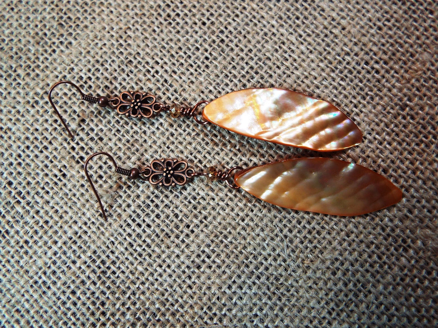 Peachy, amber colored shell and antiqued copper dangle earrings