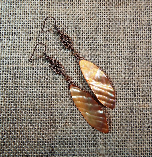 Peachy, amber colored shell and antiqued copper dangle earrings
