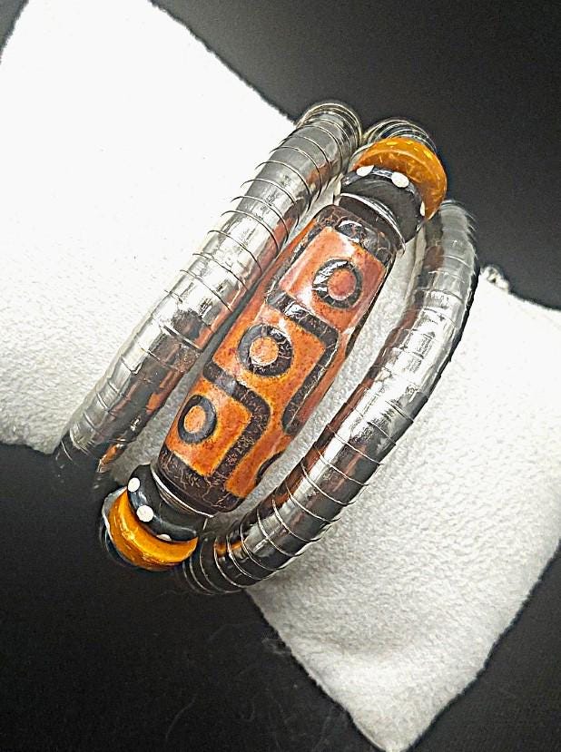 Burnt orange Tibetan nine-eyed Dzi bead wrap bracelet. One size fits most.