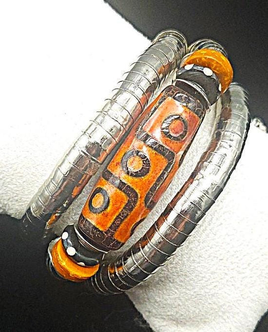 Burnt orange Tibetan nine-eyed Dzi bead wrap bracelet. One size fits most.